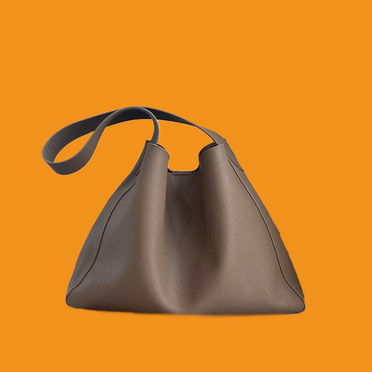 Brown handbag on an orange background