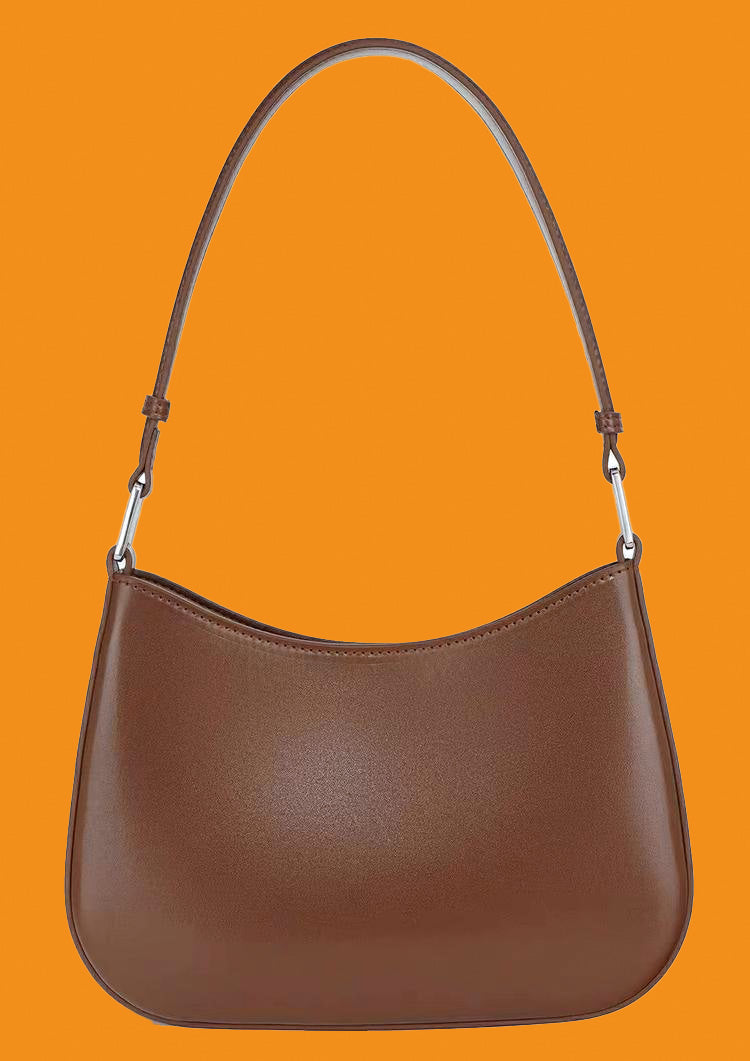 Brown handbag on an orange background