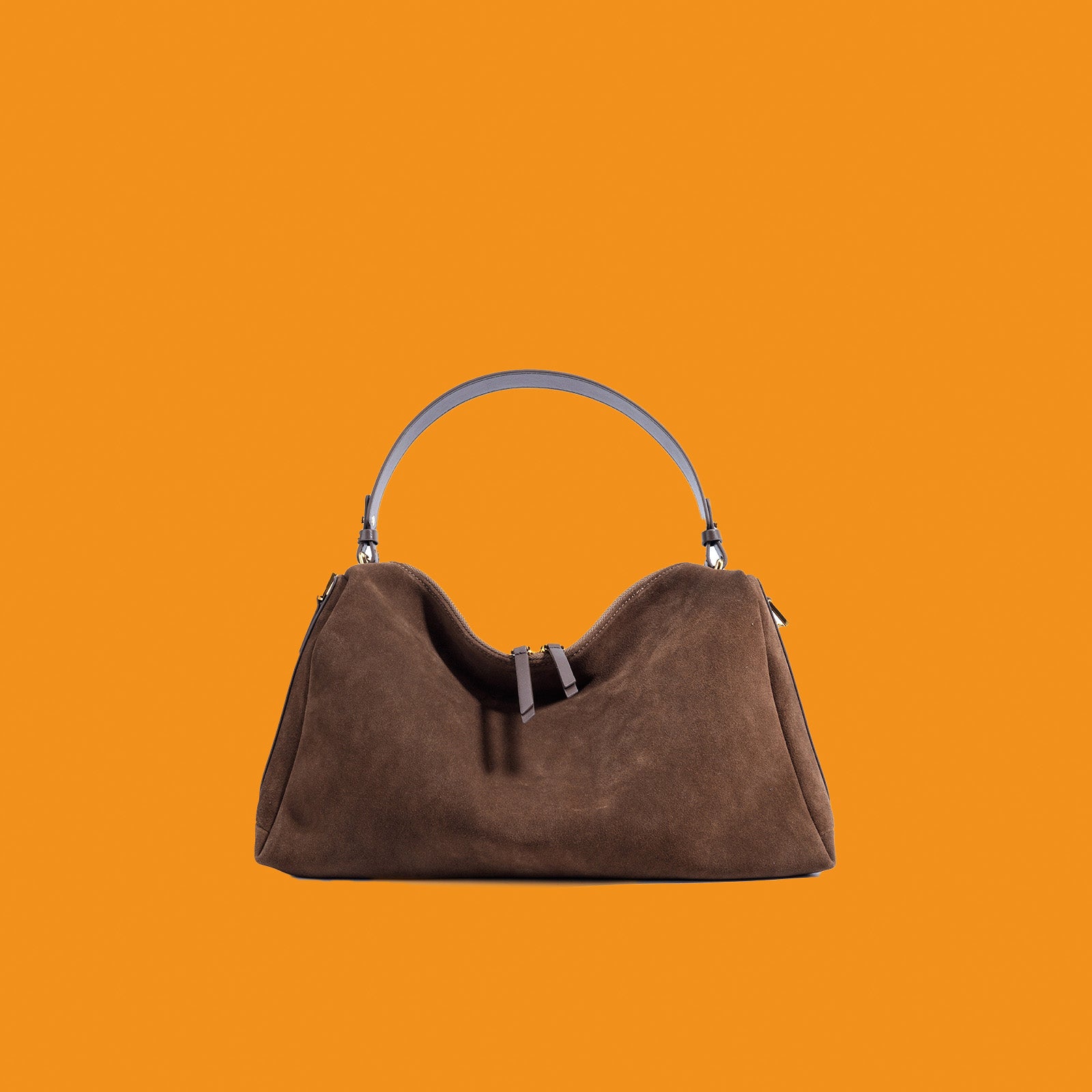 Brown handbag on an orange background