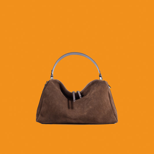 Brown handbag on an orange background
