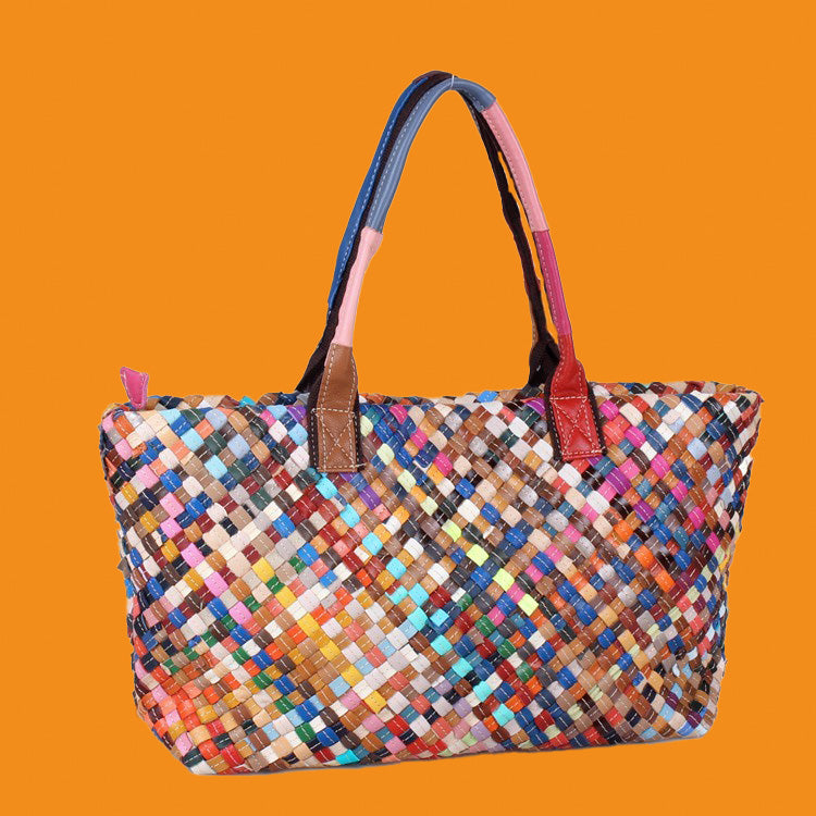 Multicolored woven bag on an orange background