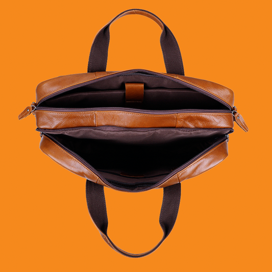 Brown leather briefcase on an orange background
