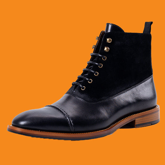 Black leather boot with brown sole on an orange background