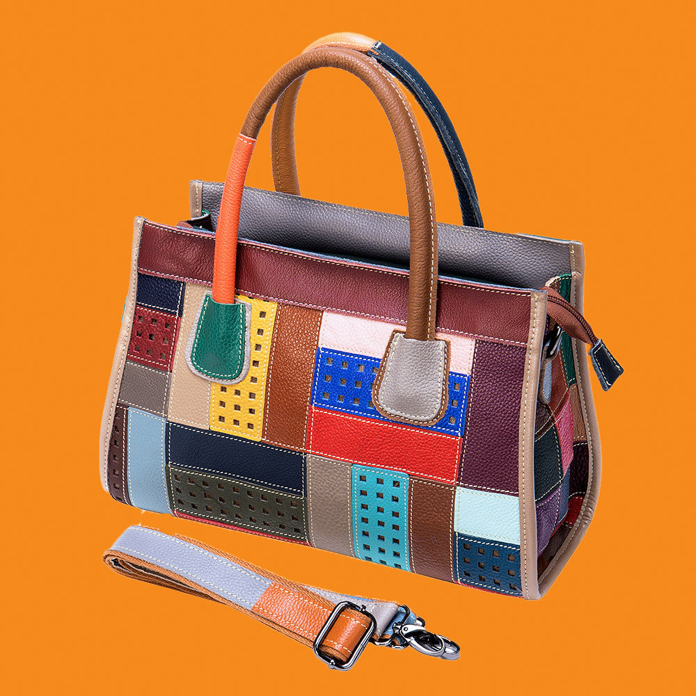 Multicolored patchwork handbag with a strap on an orange background
