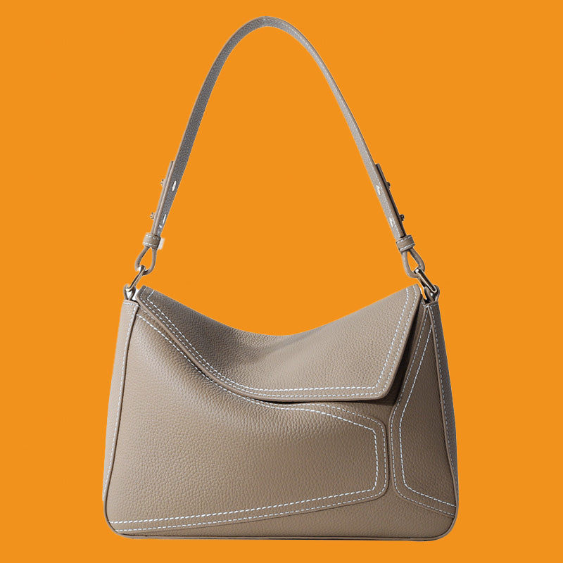 Gray handbag on an orange background