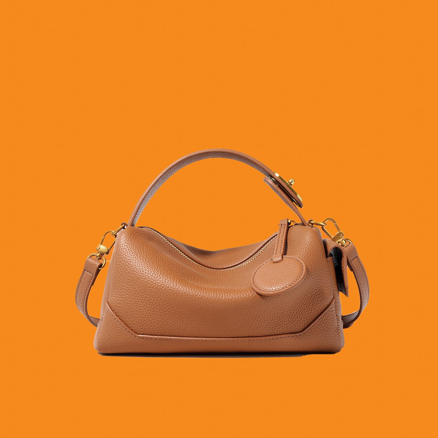 Brown handbag on an orange background