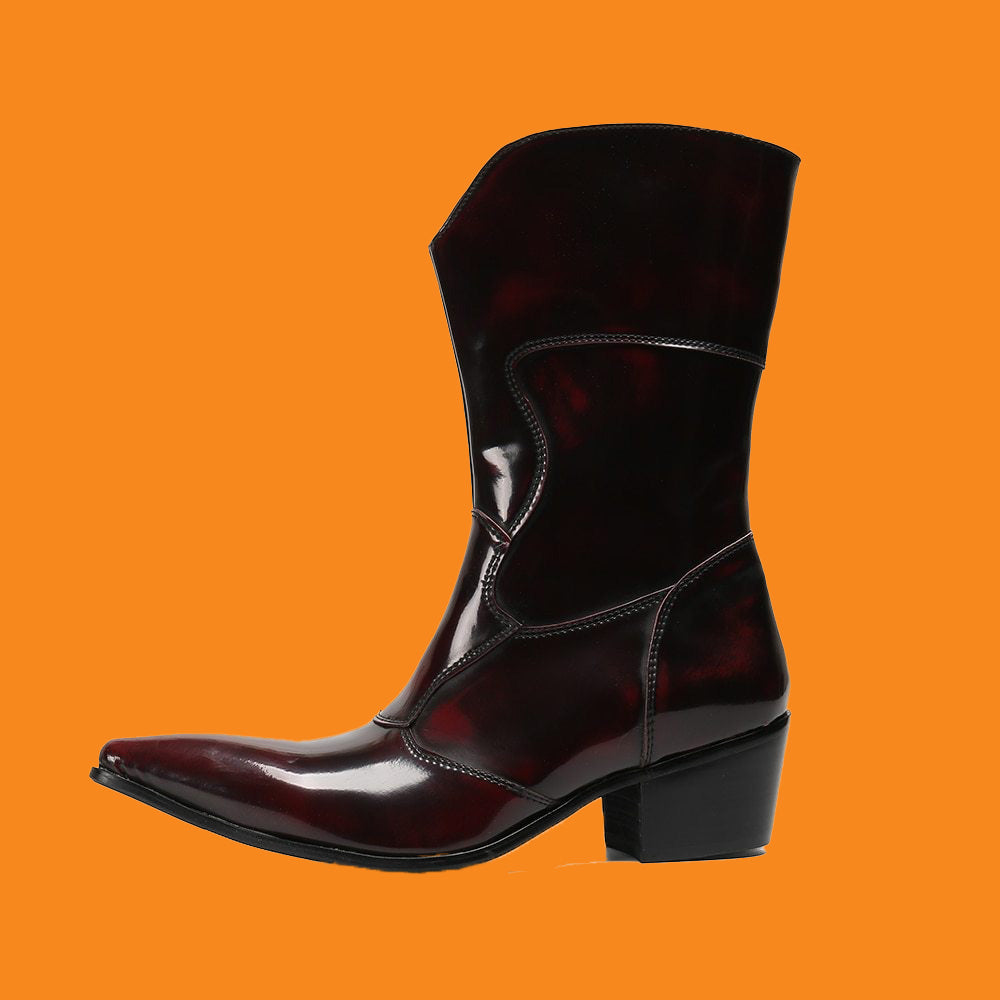 Shiny black boot on an orange background