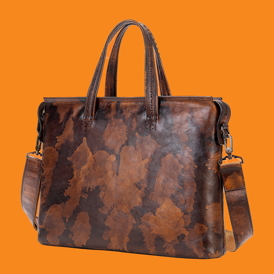 Brown leather handbag with camouflage pattern on an orange background