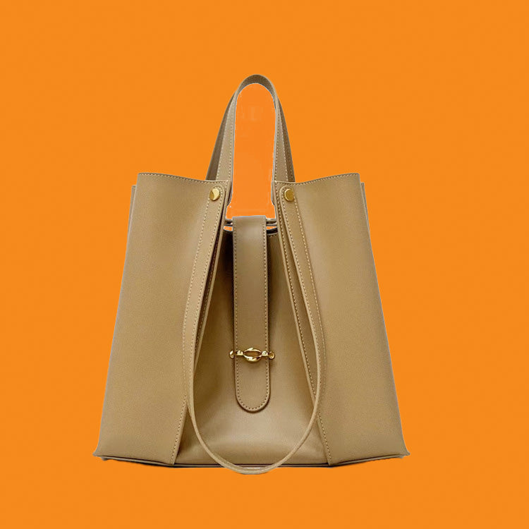 Beige handbag on an orange background