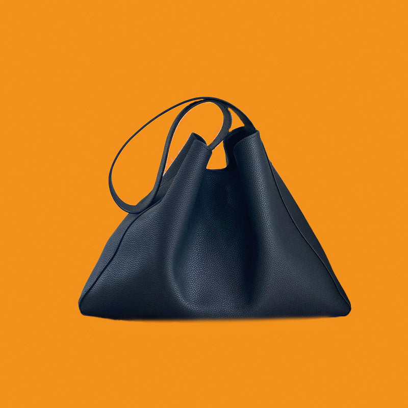 Black handbag on an orange background