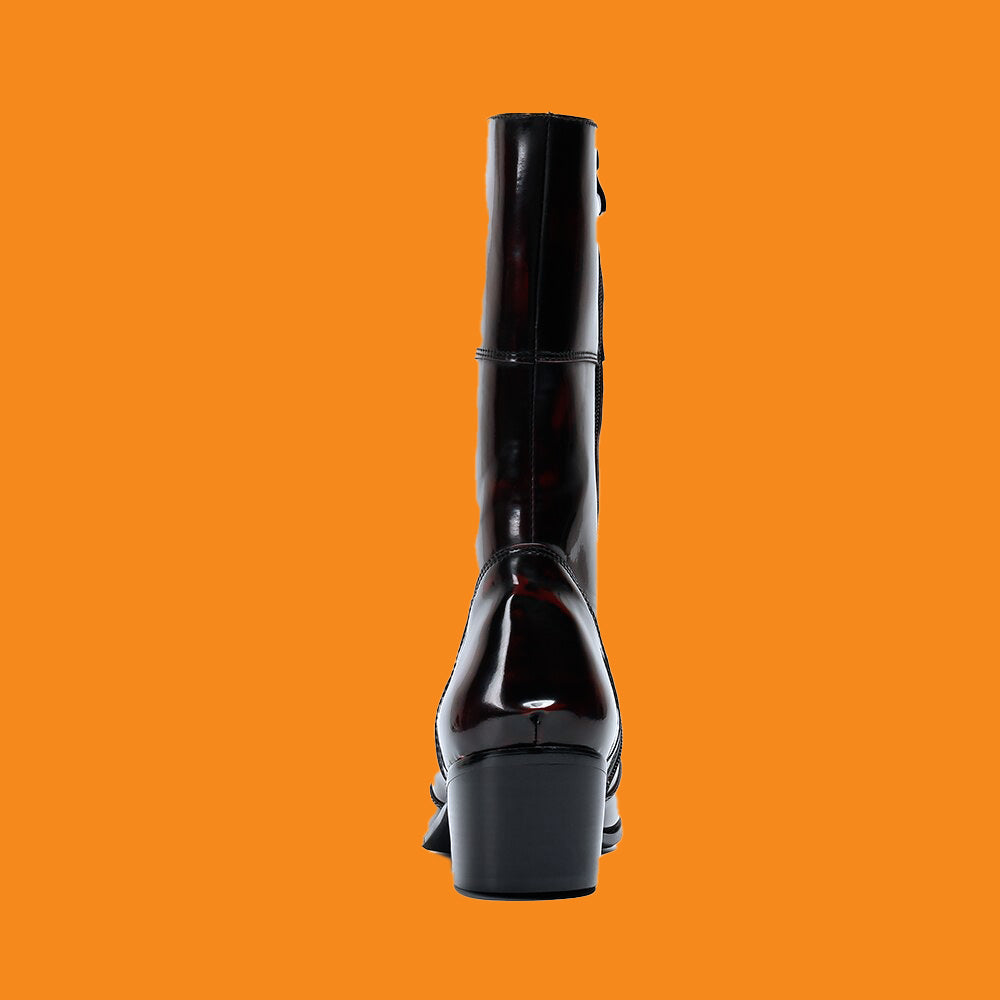 Black knee-high boot on an orange background