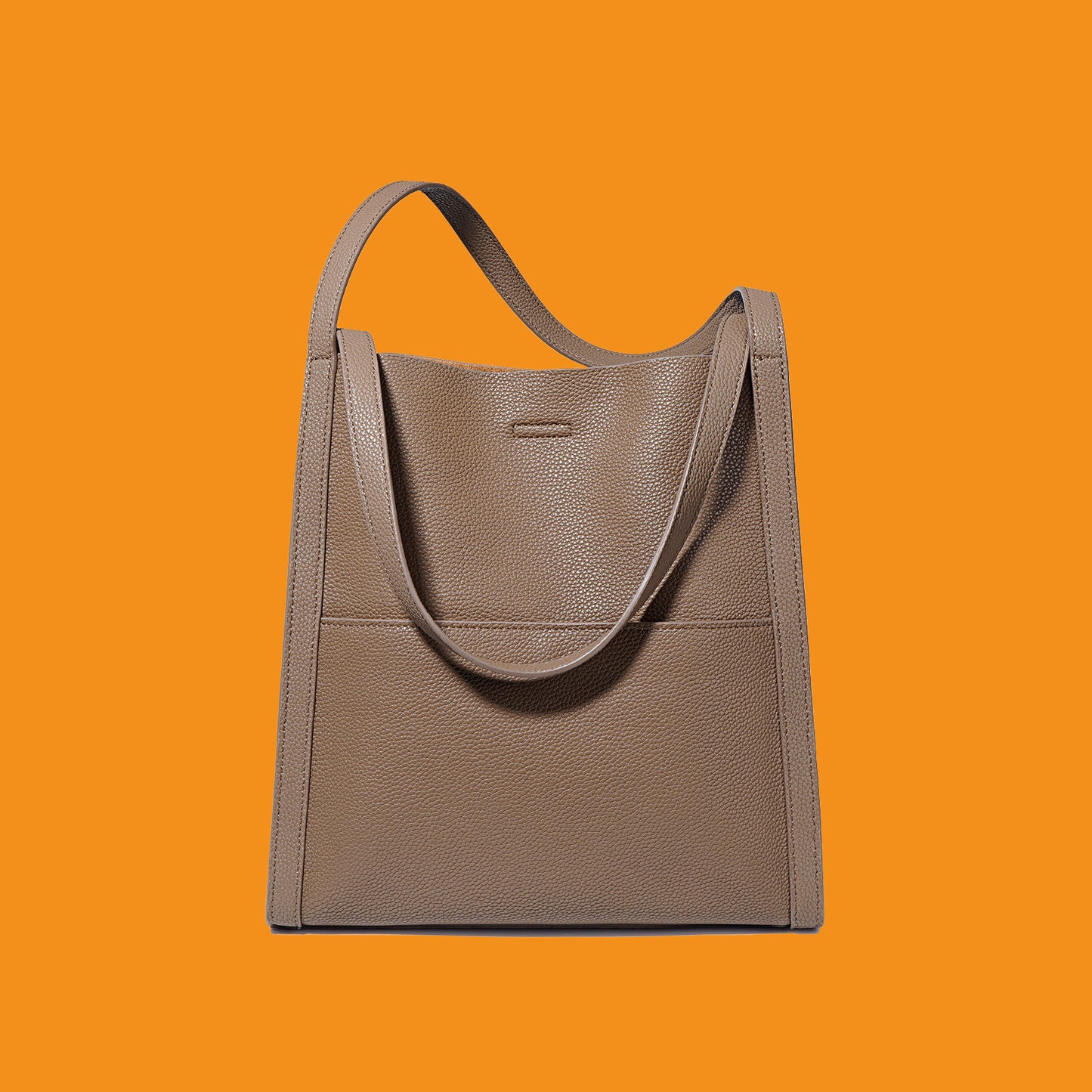 Brown tote bag on an orange background