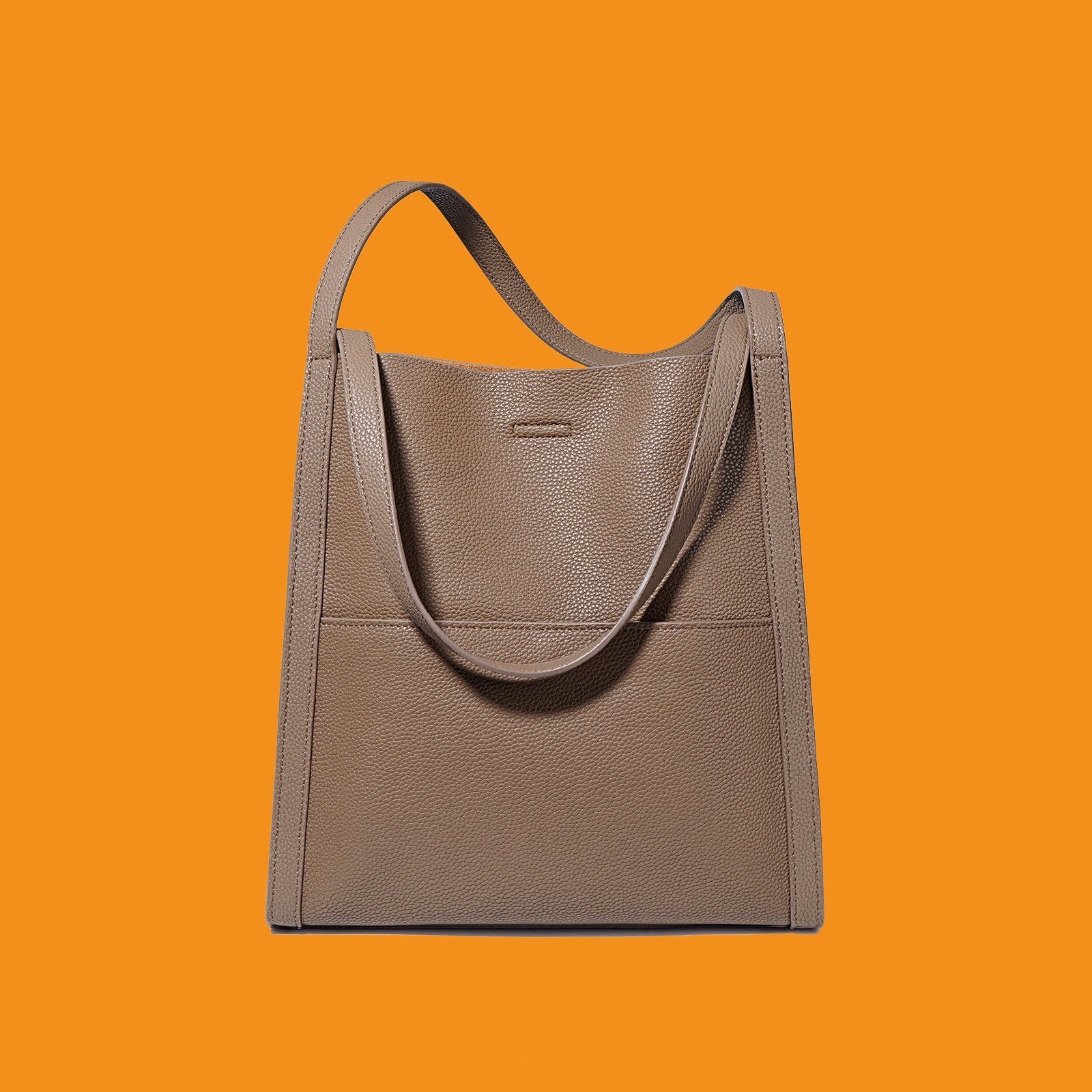 Brown tote bag on an orange background