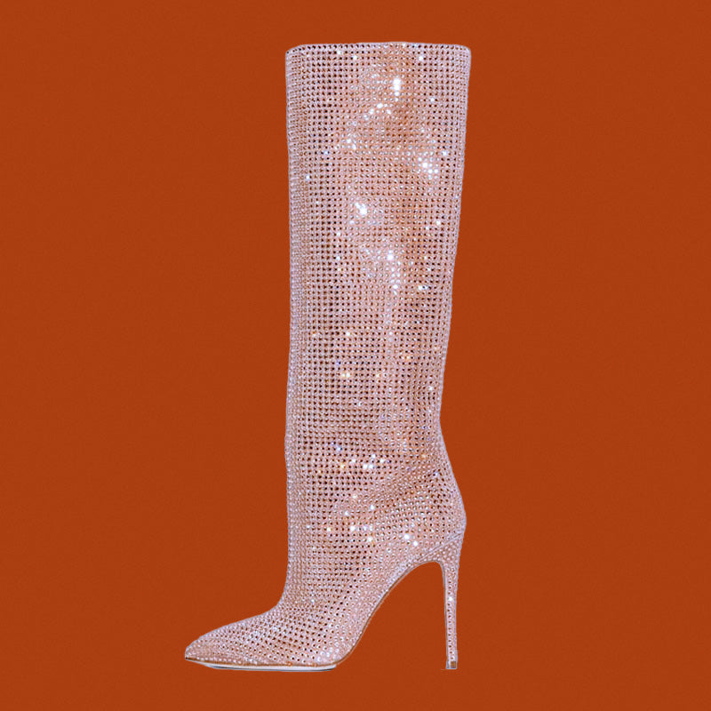 Sparkly knee-high boot on an orange background