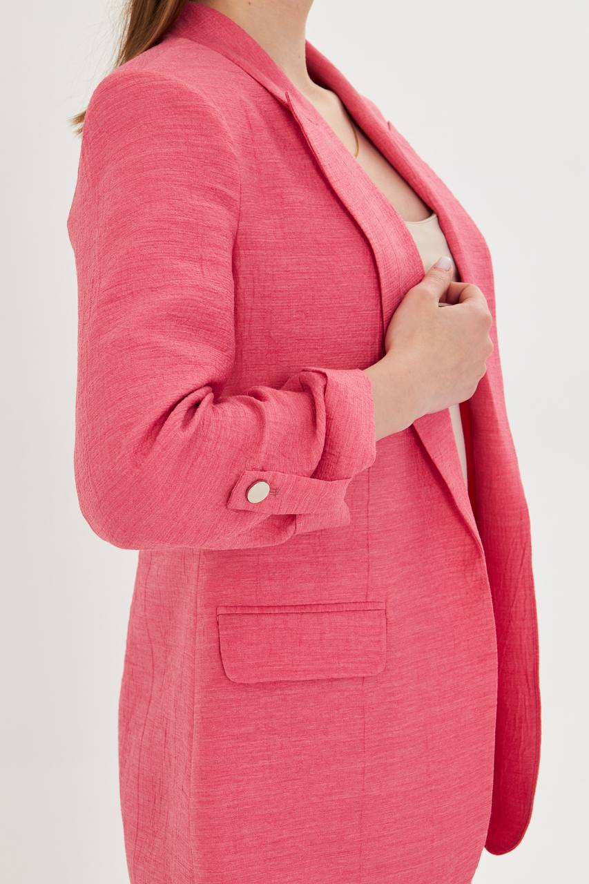 Close-up of a pink blazer on a white background