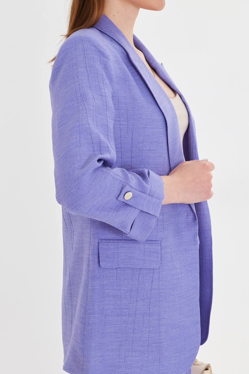 Purple blazer worn by a person on a white background