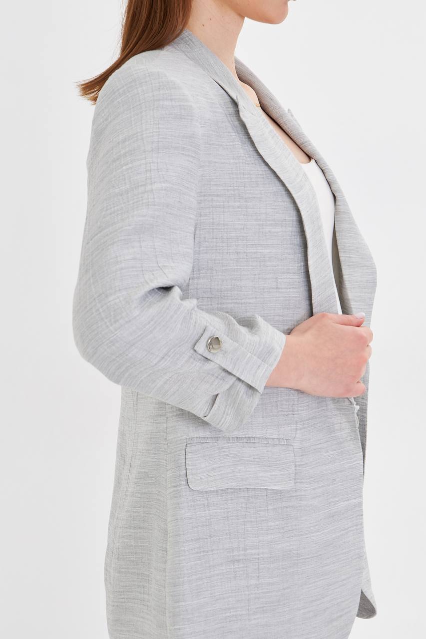Gray textured blazer worn by a person on a white background