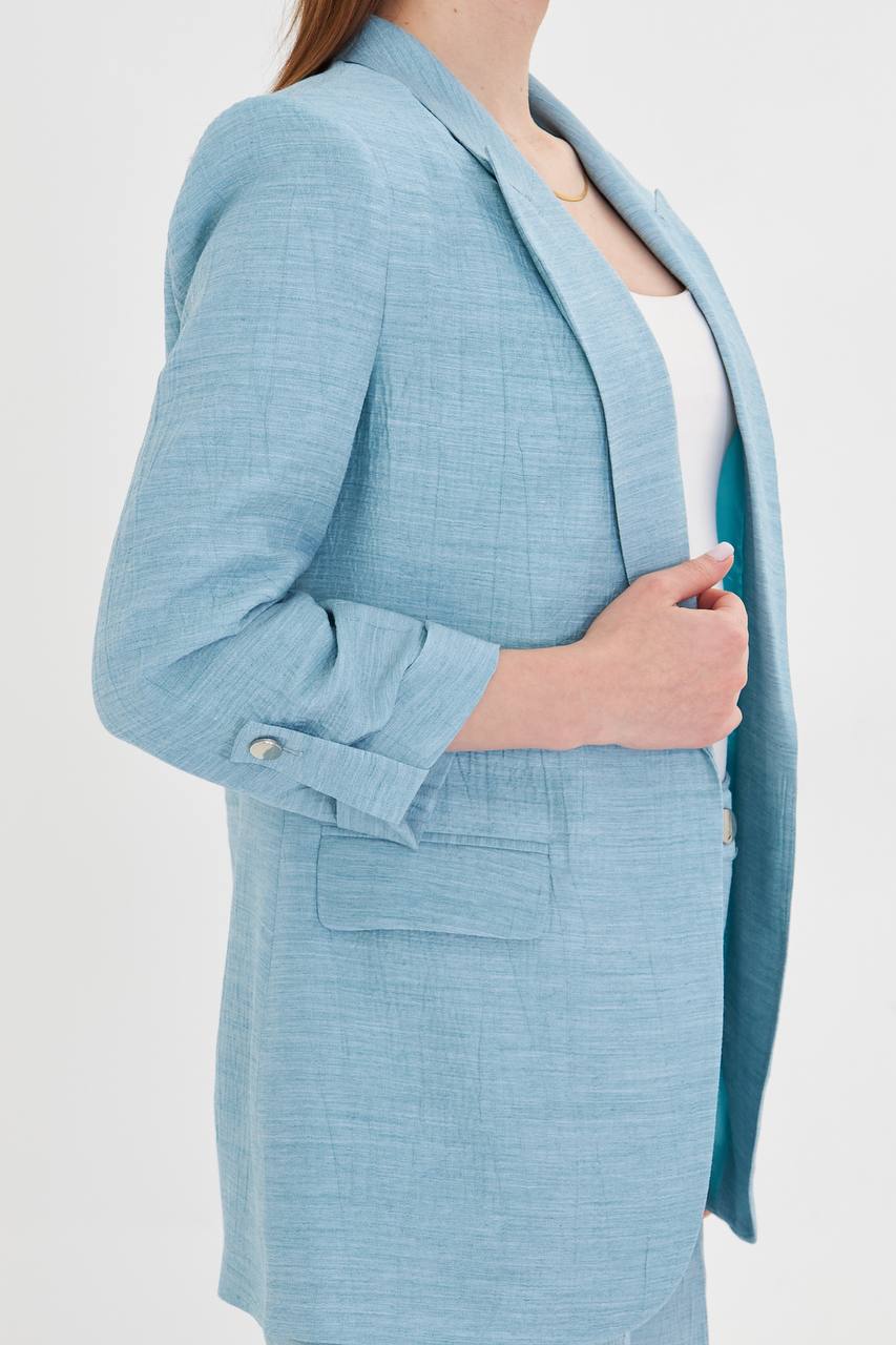 Light blue suit jacket worn by a person on a white background
