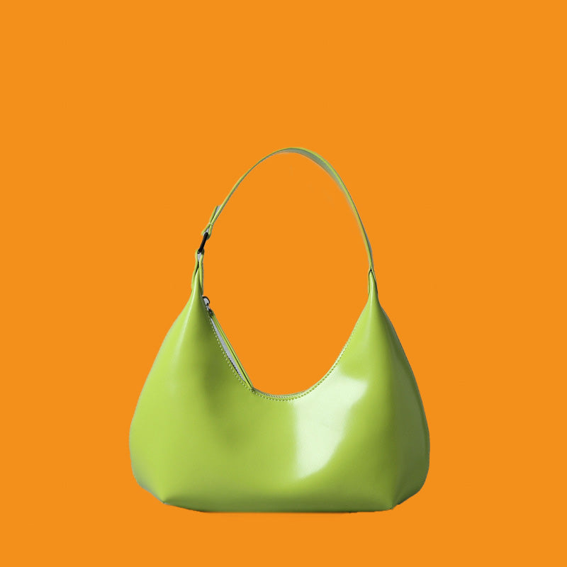 Green handbag on an orange background