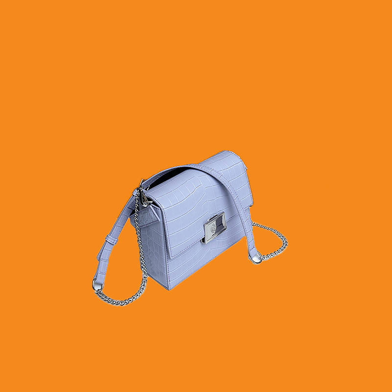 Blue handbag with a chain detail on an orange background