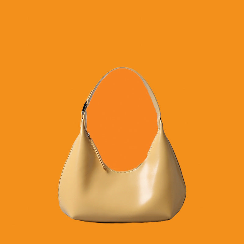 Beige handbag on an orange background