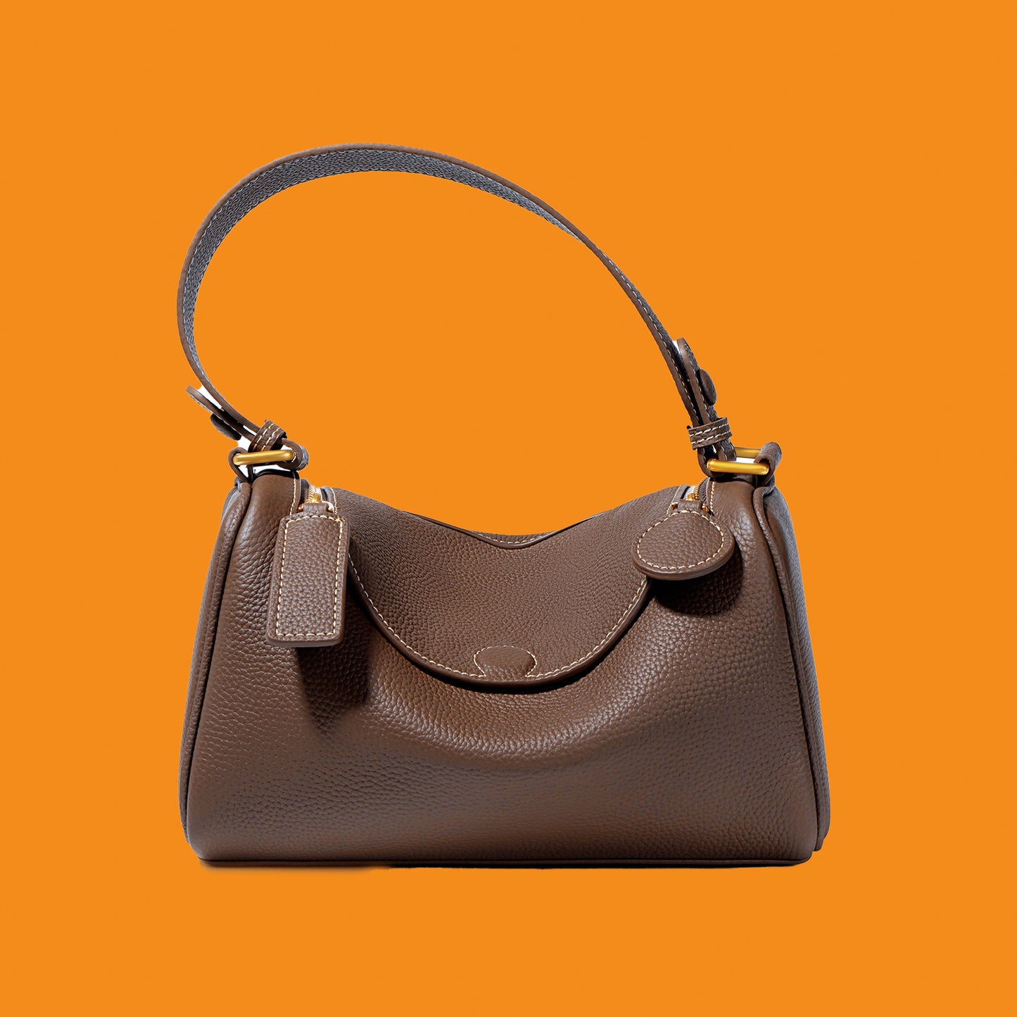 Brown handbag on an orange background