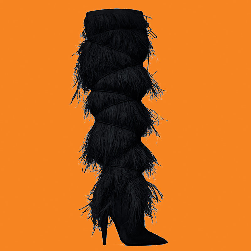 Black feathered high-heeled boots on an orange background